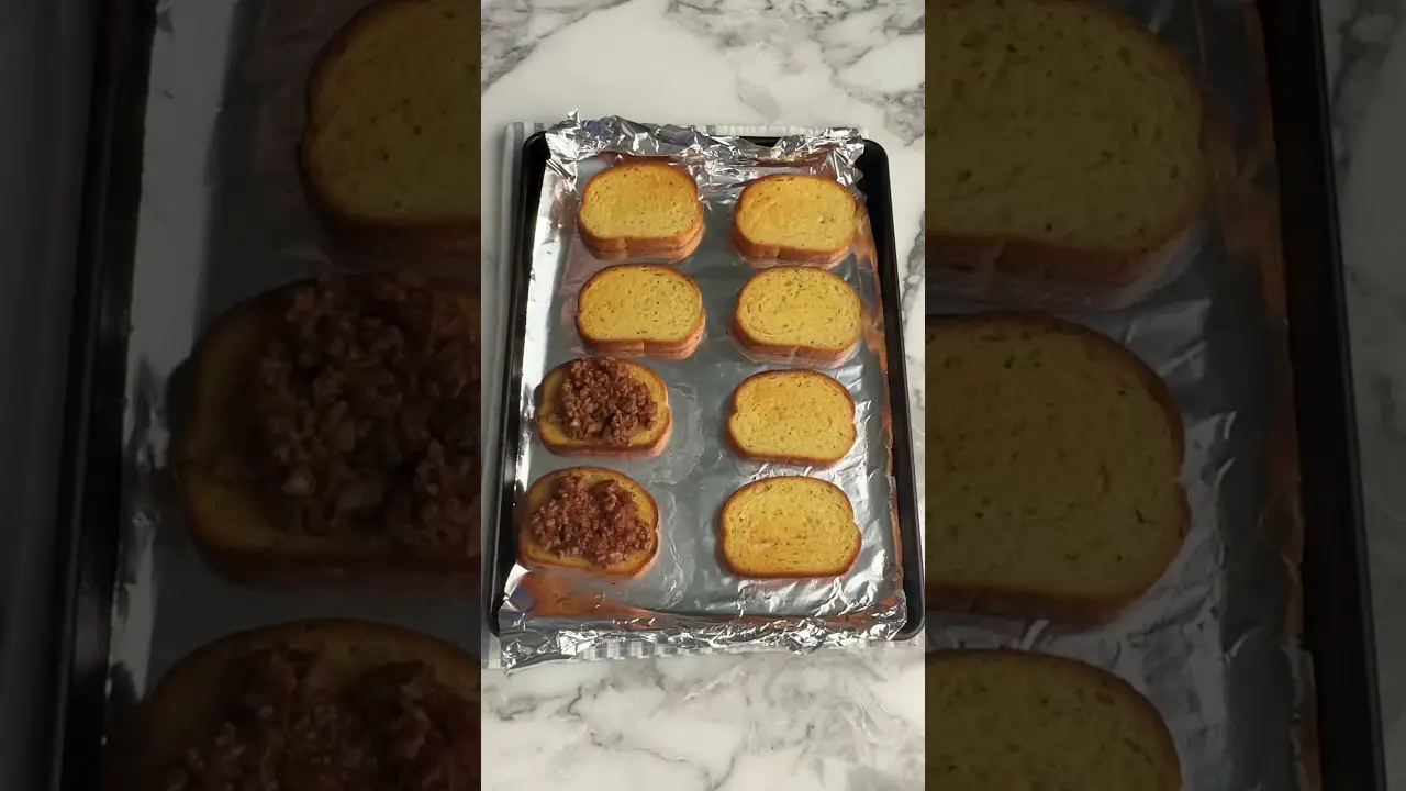Faced Cheesy Sloppy Joes on Garlic Bread