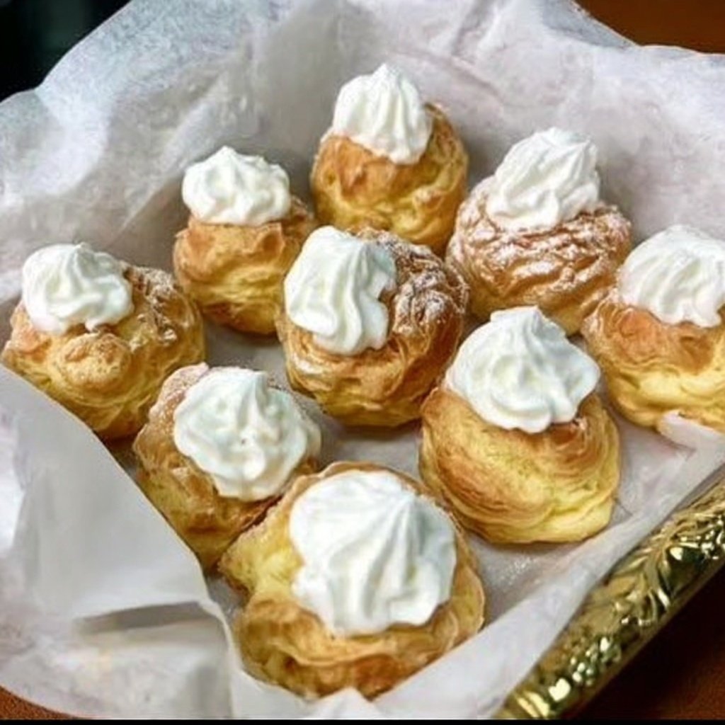 homemade cream puffs light airy and filled with sweet vanilla whipped cream